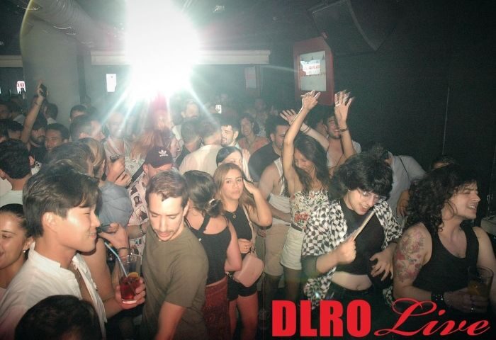 DLRO Live Gay Club in Madrid: A crowded dance floor with people dancing at the popular gay club. Nightlife scene, Madrid gay travel.