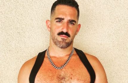 Daddy Big Hands: Man with mustache, chest hair, chain, and leather harness. Gay travel advice from Roy. Daddy-Big-Hands.jpg