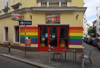 Das Gugg gay bar in Vienna. Rainbow flag colors adorn the exterior of this welcoming gay travel destination. Cafe and LGBTQ+ scene.