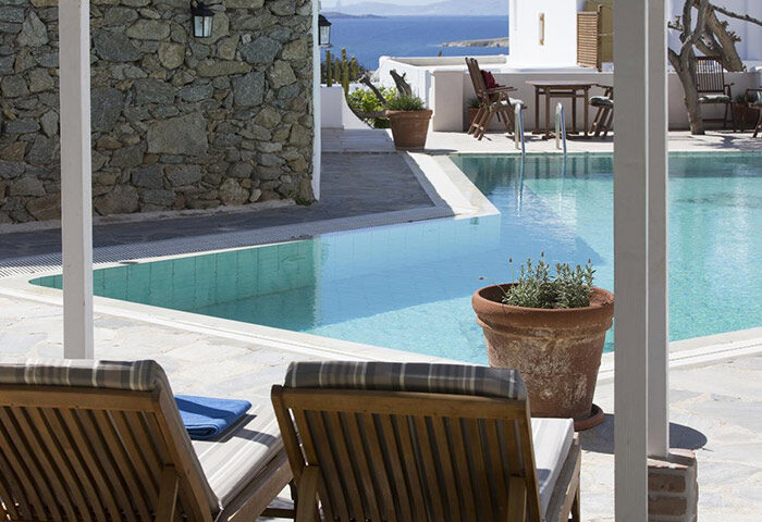Despotiko Hotel pool view in Mykonos Town, gayborhood. Most booked hotel in Chora, Greece. Relaxing gay travel destination.