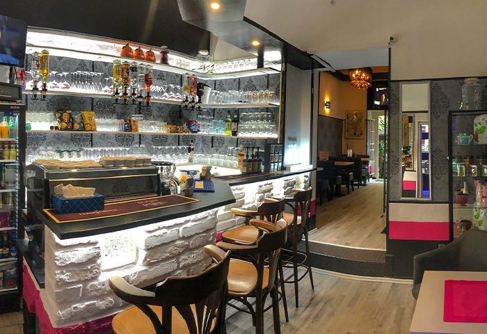 Destiny Club & Music Lounge Bar (Jamba Dampa) interior. Bar with stools, shelves with glasses and bottles. Gay travel advice. Destiny.jpg