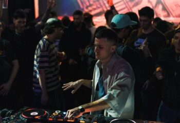 DJ at Disco City Hall, a gay club in Barcelona. Crowd of gay men dancing. Gay nightlife travel advice.