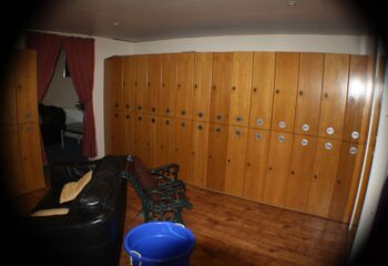 E15 Club gay sauna: Lockers, seating area, and entrance to the sauna. E15 Club is a popular gay sauna in London, UK.