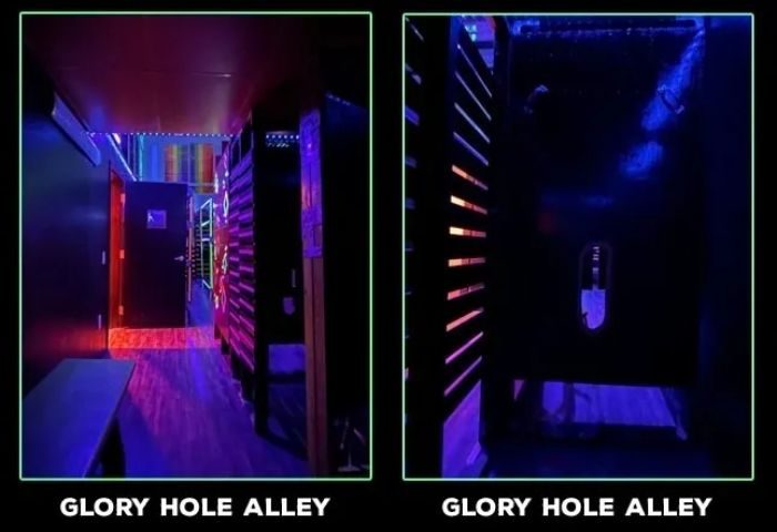 Gay cruising in San Francisco: EROS bathhouse glory hole alley. Dark corridor with cubicles for anonymous sex. Gay travel advice.