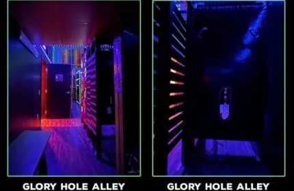 Gay cruising in San Francisco: EROS bathhouse glory hole alley. Dark corridor with cubicles for anonymous sex. Gay travel advice.