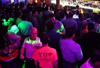 El Almacen Gay Bar in Mexico. A crowded gay bar scene with men socializing, kissing, and enjoying the nightlife in Mexico.