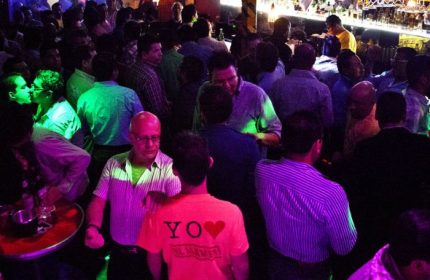 El Almacen Gay Bar in Mexico. A crowded gay bar scene with men socializing, kissing, and enjoying the nightlife in Mexico.