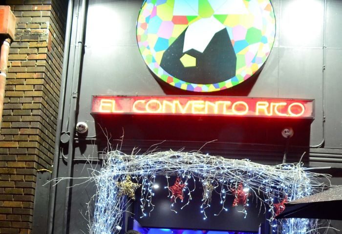 El Convento Rico Night Club entrance in Toronto. Neon sign, colorful logo, and festive lights adorn this gay-friendly travel destination.