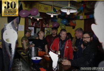 Interior of El Horno Gay Bar in Sitges, Spain. Gay men at the bar, celebrating 30th anniversary. Gay travel advice, nightlife.