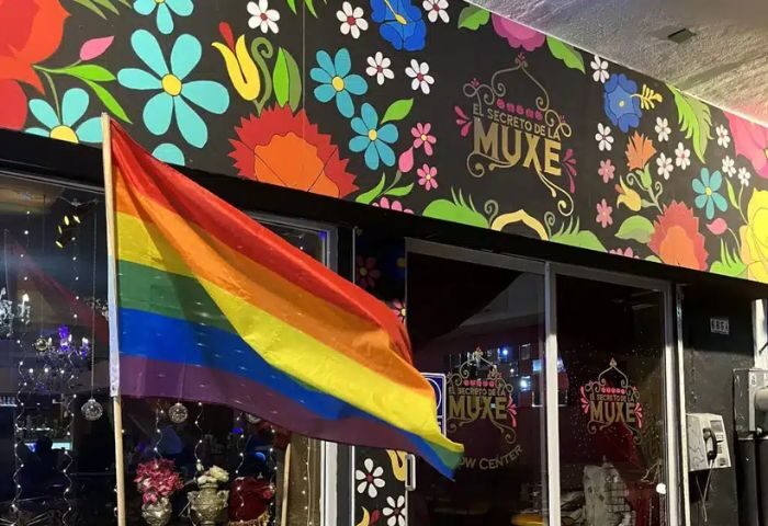 El Secreto de la Muxe gay bar in Puerto Vallarta. Rainbow flag, floral design, and the bar's name are visible. Gay travel advice.