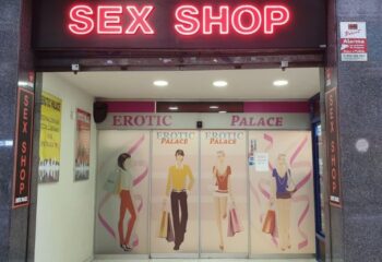 Erotic Palace sex shop in Barcelona. Neon sign above the entrance. Gay cruise club related. Travel advice for gay men.