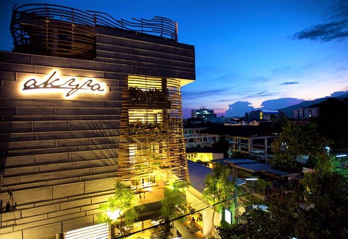 Akyra Manor Hotel, Chiang Mai. LGBT luxury hotel with excellent city center location at dusk. Gay travel destination.