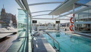 Rooftop pool at Room Mate Oscar, a gay-friendly hotel in Madrid's Chueca neighborhood. Ideal gay honeymoon hotel with excellent views.
