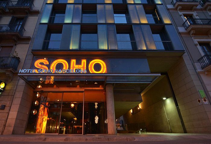 Hotel Soho Barcelona facade at dusk. Excellent location near gay bars. A top choice for gay men visiting Barcelona, Spain.