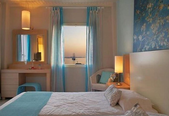 Porto Mykonos Hotel room with sea view. Excellent location near gay bars in Mykonos Town. Gay hotel with comfortable beds.