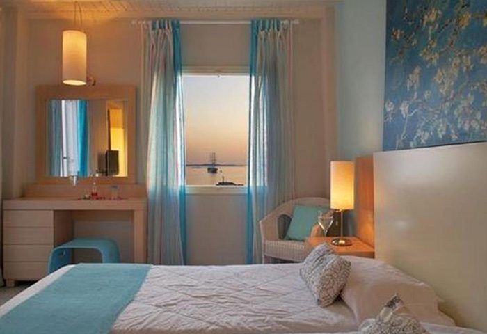 Porto Mykonos Hotel room with sea view. Excellent location near gay bars in Mykonos Town. Gay hotel with comfortable beds.
