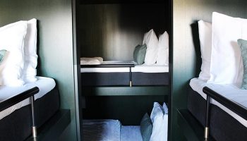 Hotel Danmark by Brøchner Hotels room. Excellent location for gay nightlife in Copenhagen. Pod-style beds with modern design.