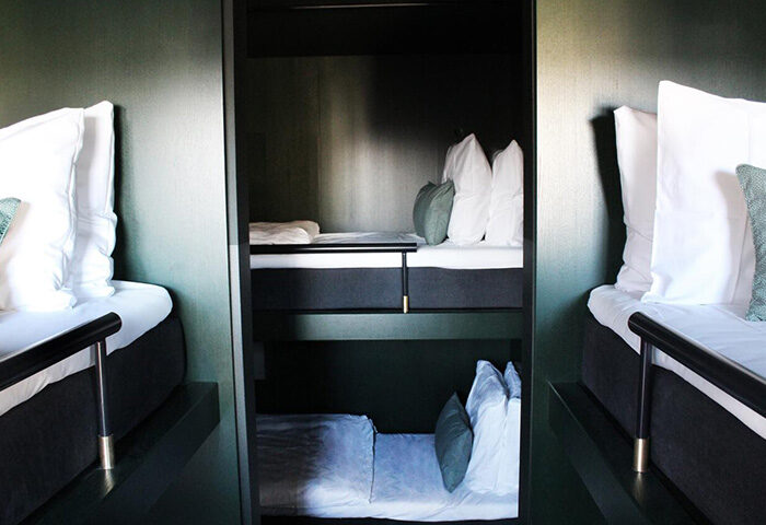 Hotel Danmark by Brøchner Hotels room. Excellent location for gay nightlife in Copenhagen. Pod-style beds with modern design.