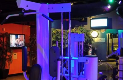 Steamworks gym in Vancouver, Canada. Gay sauna with fitness center, gym equipment, TV screens, and blue lighting. Gay travel advice.