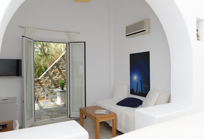 Elena Hotel, Mykonos Town. Gay hotel room with private balcony. Last minute cheap price. White interior, minimal design. Balcony view.
