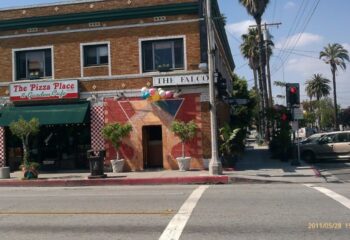 Falcon gay bar location in Long Beach. The Falcon's entrance is decorated with balloons. Next to The Pizza Place & Garden Cafe.