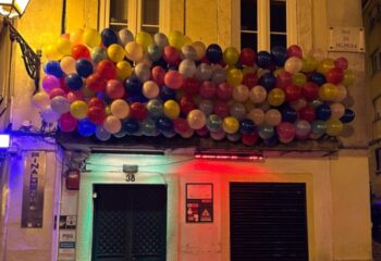 Finalmente Club Lisbon entrance decorated with colorful balloons. Gay travel advice for Lisbon's gay nightlife.
