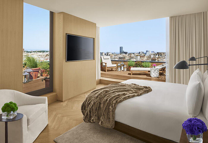Luxury honeymoon suite at The Barcelona EDITION in Eixample. Balcony with city views. Best hotels for gay travel in Barcelona.
