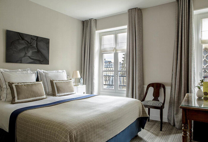 Hotel de la Place du Louvre bedroom. Find best price hotel for weekend in Marais. Gay-friendly room in Paris. Travel advice for gay men.