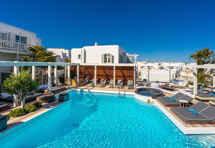 Semeli Hotel Mykonos pool area. Luxury gay hotel in Mykonos City Center with pools, sunbeds, and a jacuzzi. Find best price last minutes.
