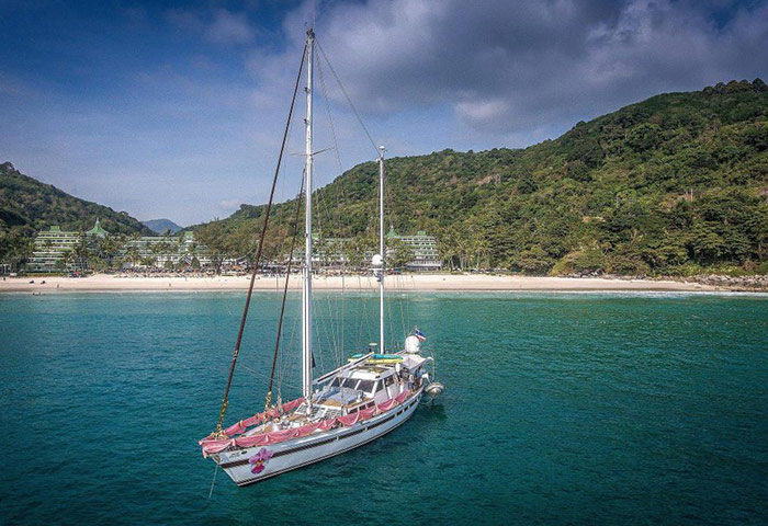 Le Meridien Phuket Beach Resort view from a boat. Luxury beachfront hotel in Phuket. Gay travel to Thailand.