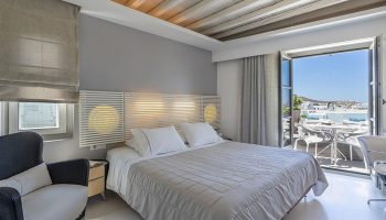 Semeli Hotel Mykonos room. Luxury gay hotel in Mykonos Town with balcony view. Find cheap hotels in low season for gay men's travel.