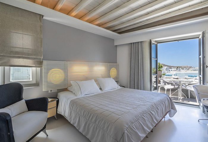 Semeli Hotel Mykonos room. Luxury gay hotel in Mykonos Town with balcony view. Find cheap hotels in low season for gay men's travel.