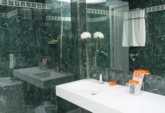 Gran Canaria Princess Adults Only hotel bathroom. Modern sink, green marble tiles. Near Yumbo Center gay nightlife. Cheap price hotel.