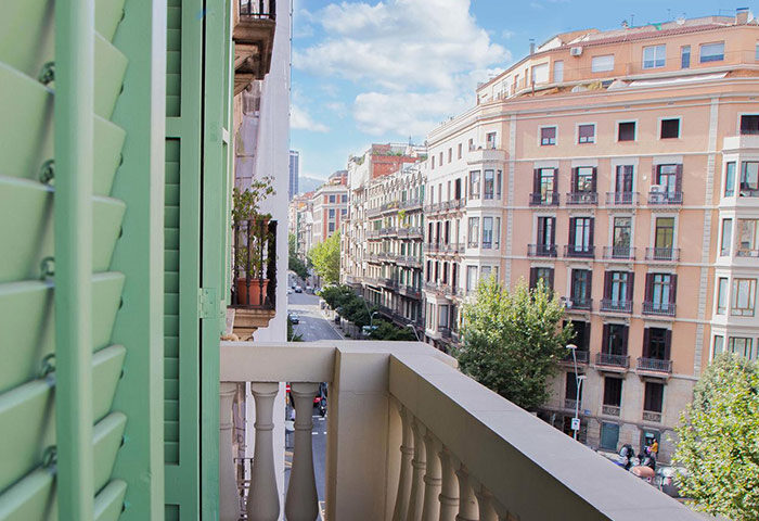 View from Sant Jordi Hostels Rock Palace, a gay hostel in Barcelona city center. Balcony overlooking a street, ideal for gay travelers.