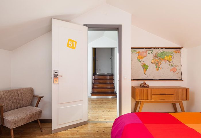 Yes! Lisbon Hostel double room for 4 people. Gay hostel in Lisbon city center. Room 51, map, chair, and colorful bedspread.