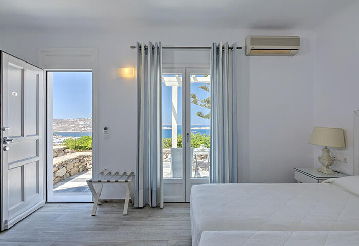 Mykonos Hotel Alkyon room with private terrace view. Cheap last minute hotel deal. Gay travel destination with sea view.