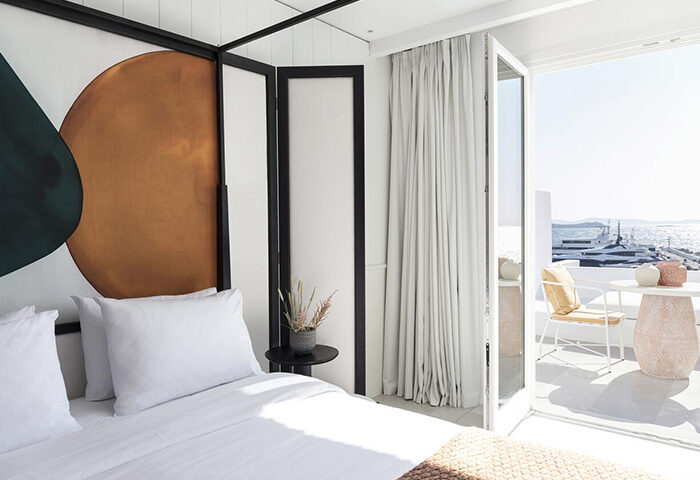 Porto Mykonos Hotel room with private terrace. Gay hotel in Mykonos Town offers cheap, last-minute prices. Sea view from room's balcony.