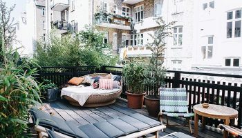 Axel Guldsmeden Hotel in Copenhagen balcony view. Find last minute cheap gay hotel deals. Relaxing outdoor space with plants and daybeds.