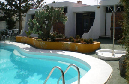Bungalows Tenesoya, a gay men-only adults-only hotel in Playa del Ingles, Gran Canaria. Pool view of the most booked hotel.
