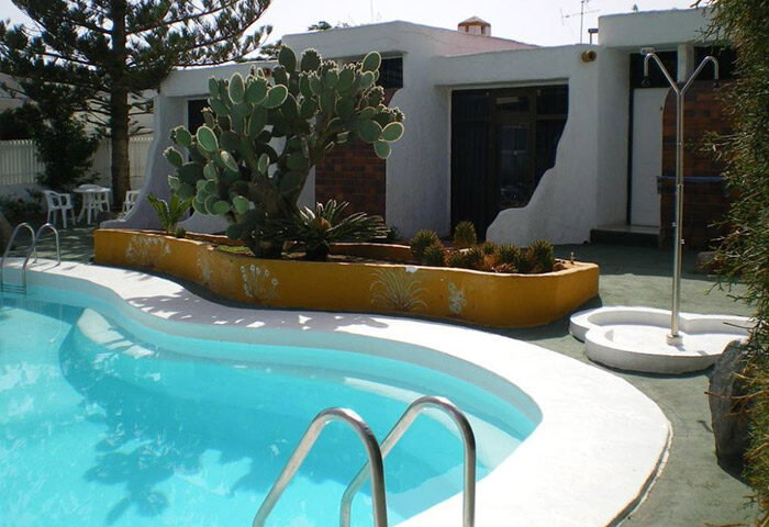 Bungalows Tenesoya, a gay men-only adults-only hotel in Playa del Ingles, Gran Canaria. Pool view of the most booked hotel.