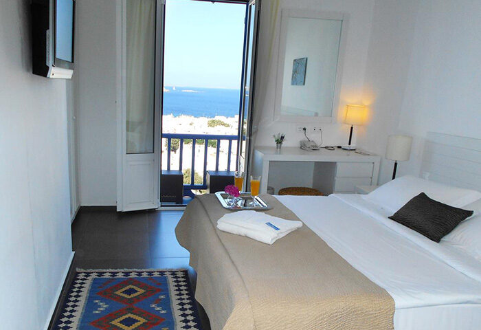 Portobello Boutique Hotel room, Mykonos. Balcony view, gay-friendly lodging. Find small gay hotel with the best reviews in Mykonos Gayborhood.