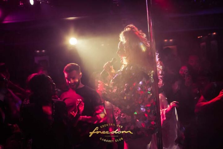 Freedom Bar Soho, London. Cabaret performer sings at the gay bar, a popular nightlife spot. Gay travel advice for London's scene.