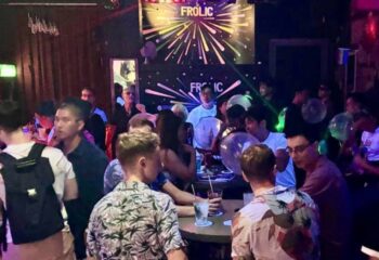Frolic Bar Ho Chi Minh City scene. Gay nightlife spot with a diverse crowd enjoying drinks and socializing in a lively atmosphere.