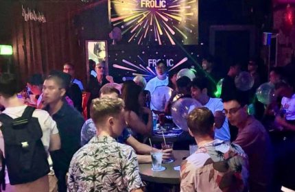 Frolic Bar Ho Chi Minh City scene. Gay nightlife spot with a diverse crowd enjoying drinks and socializing in a lively atmosphere.