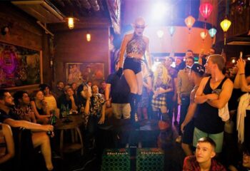 Full Disclosure Entertainment, biggest gay bar in Ho Chi Minh. Drag queen performing for a crowd. Gay travel guide nightlife.