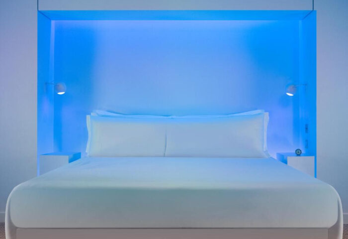 St Martins Lane Hotel London bedroom with blue lighting. Fun city hotel near gay nightlife in Soho. Ideal for gay travel.