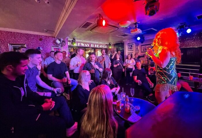 Drag show at Halfway To Heaven, a fun gay bar in London near G-A-Y Heaven. People watch the performance in the lively atmosphere.