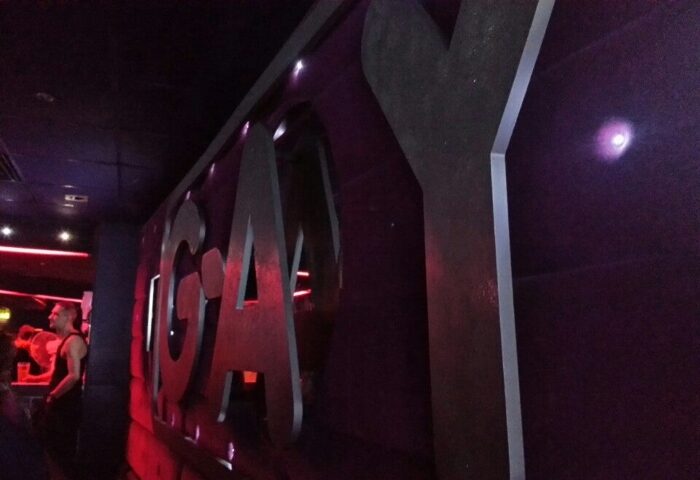 G-A-Y Late, a popular gay bar in London's Soho on Old Compton Street. Interior shot with the G-A-Y logo and a man in the background.