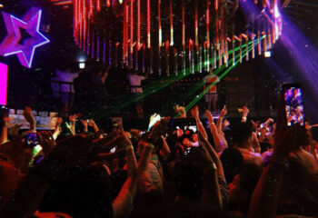 G Star Club Taipei: A packed dance floor at this popular gay club. People are dancing, with hands up, illuminated by club lights.