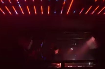 Gag Cph Copenhagen: Interior view of a gay bar in Copenhagen, Denmark. Red lights and a DJ booth create a vibrant atmosphere.
